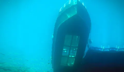 The glass bottom boat seen from underwater